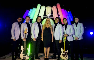 Party in Style with We Light It Up in Santorini: The LED Drum Wedding Band You Need!